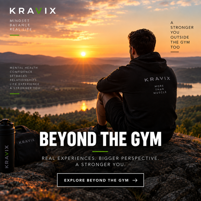 A man sits on a rocky overlook at sunset wearing a black Kravix hoodie and shorts, with a lake and mountains in the background. A black Kravix water bottle and bag sit beside him.
